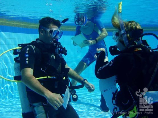 Indepth PADI CD Chris grading a CW presentation in the pool