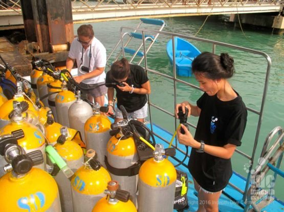 PADI Open Water Course students putting their equipment together Phuket