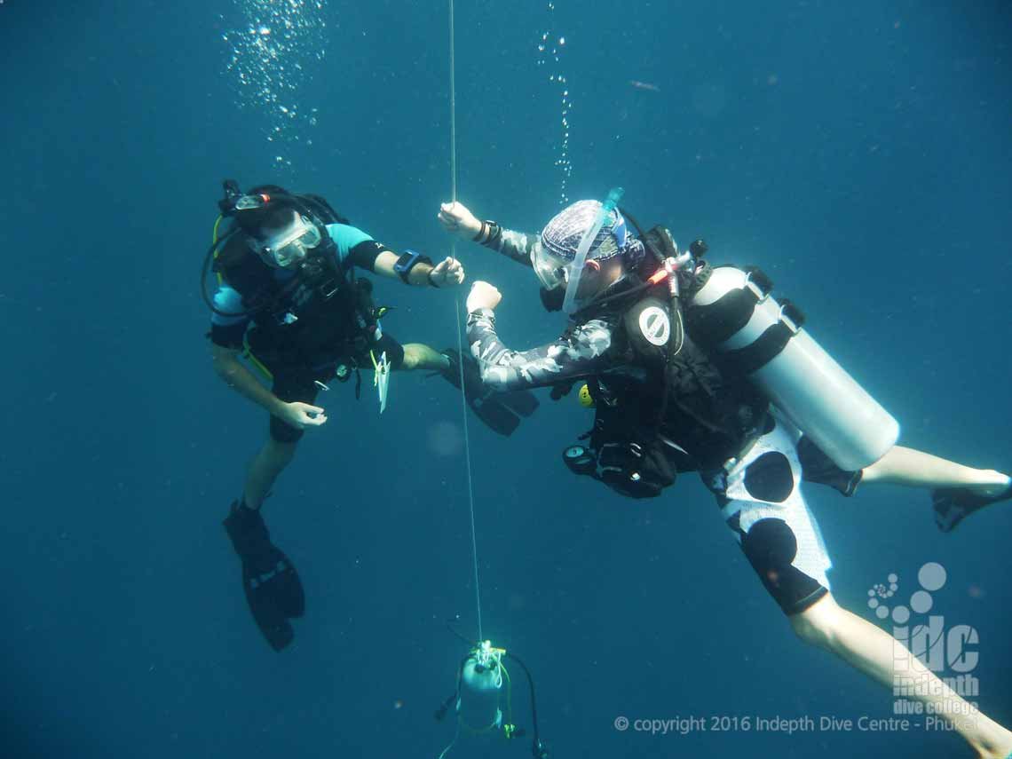 Thailand PADI Divemaster Course on Phuket: Divemaster doing a Safety Stop after a PADI Deep Diver Specialty Course Dive