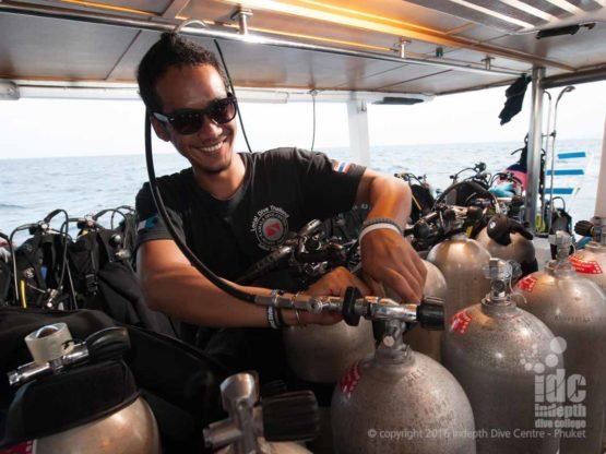 Phuket Dive Trip Boat 1: happy staff filling tanks during the surface interval on Boat 1 at Racha Yai