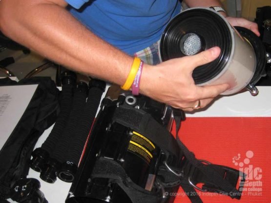 Rebreather Course student inserting the scrubber into a Poseidon Rebreather on Phuket Thailand