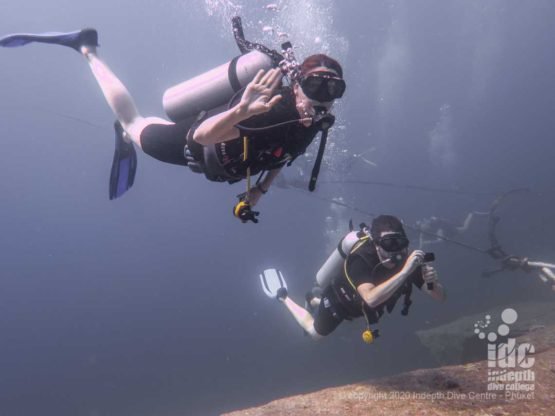 Happy divers at Shark Fin Reef Similan Dive Site
